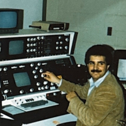 Male at a scanning electron microscope circa 1989.